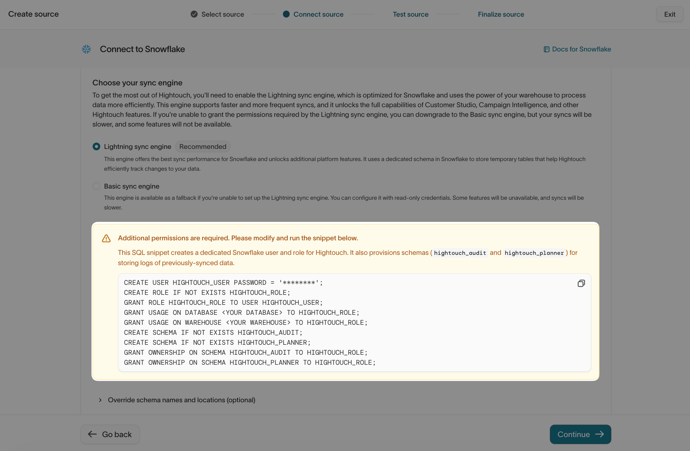 The permissions snippet that provisions Hightouch's warehouse user, role, and schemas